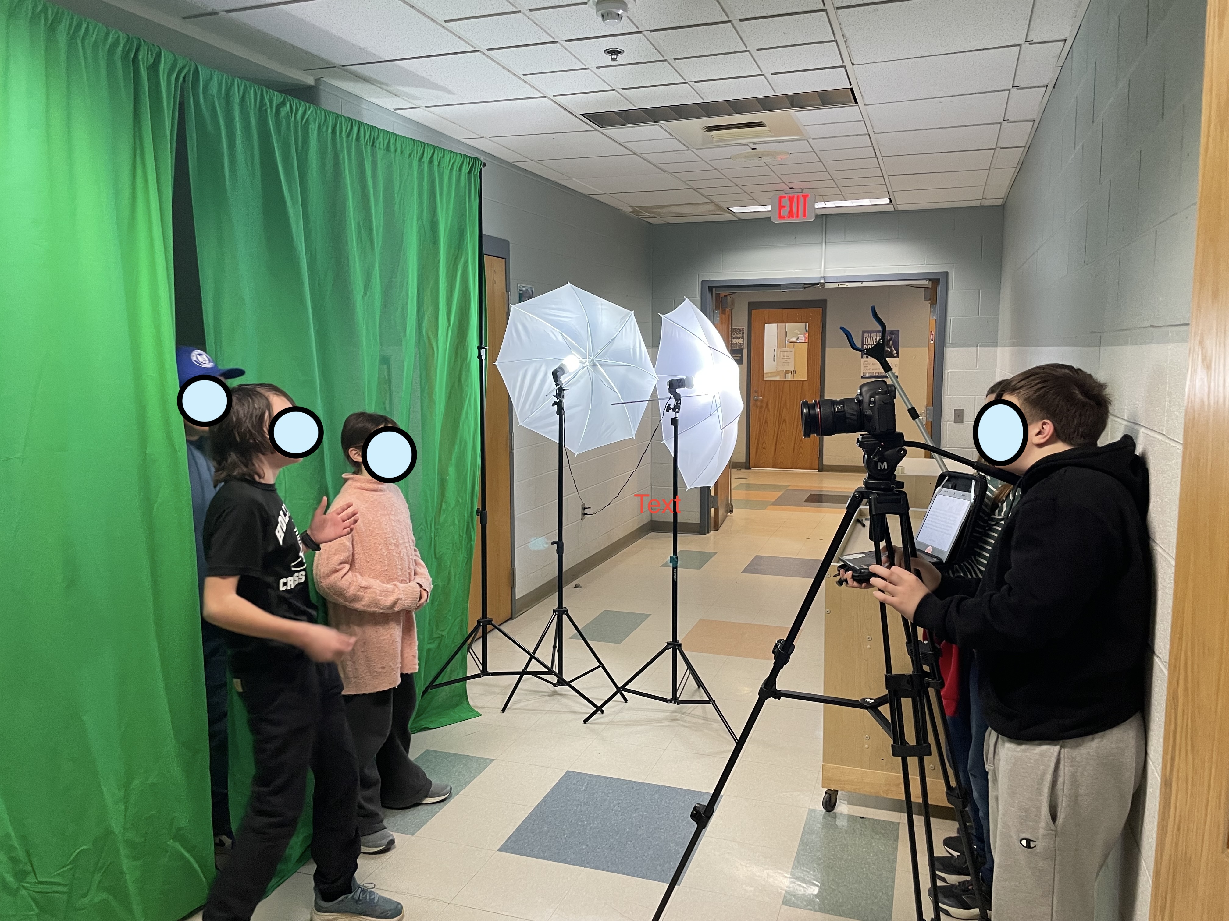 Camera Club members shooting portraits with a green screen and studio lights