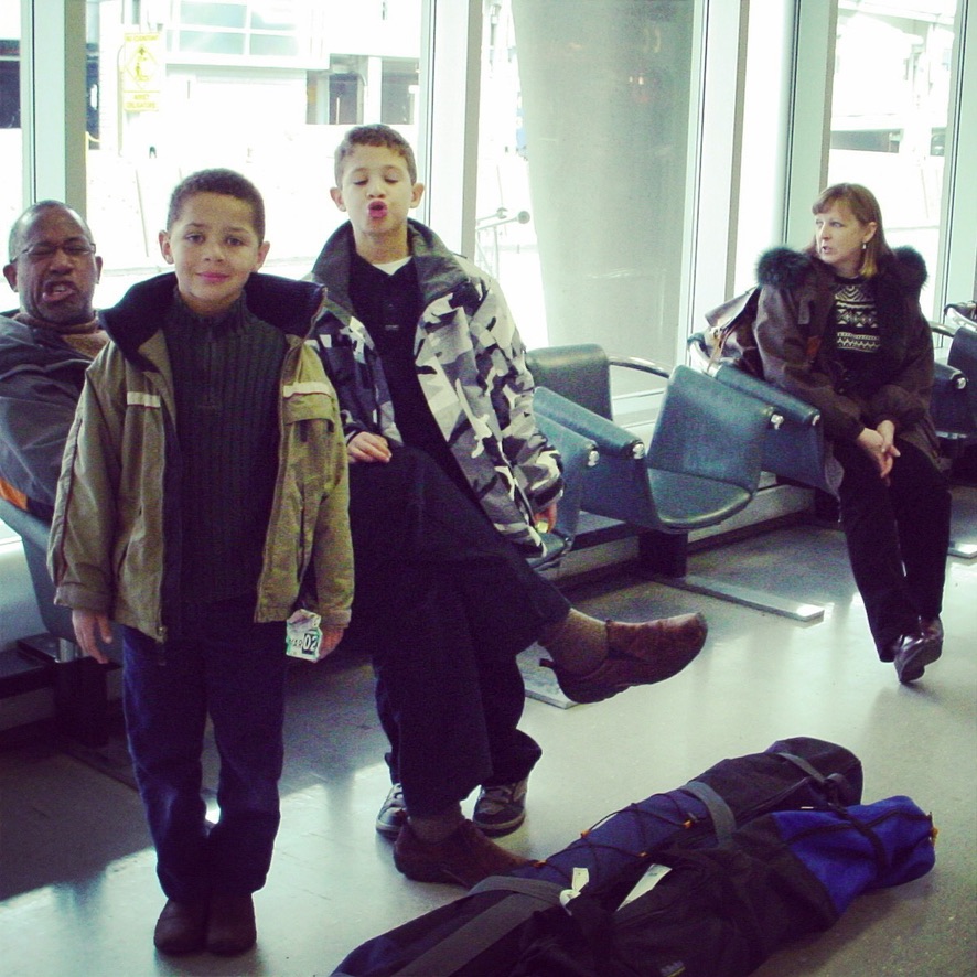 Cole and his brother as kids in an airport